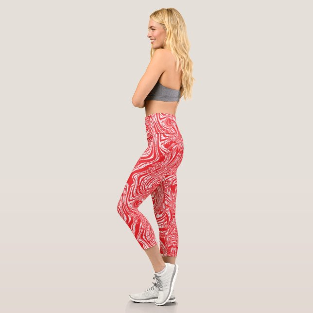 a red and white image of a pattern on a white back capri leggings (Left)