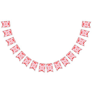 a red and white pattern with a flower on it bunting