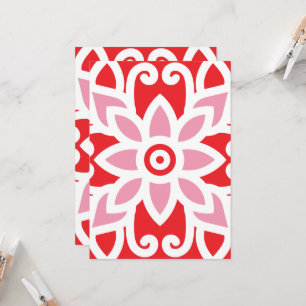 a red and white pattern with a flower on it invitation