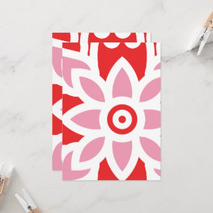 a red and white pattern with a flower on it invitation