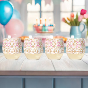 A red and white patterned image featuring a diamon stemless wine glass