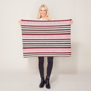 a red and white striped pattern fleece blanket