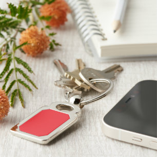 a red background with a black border key ring