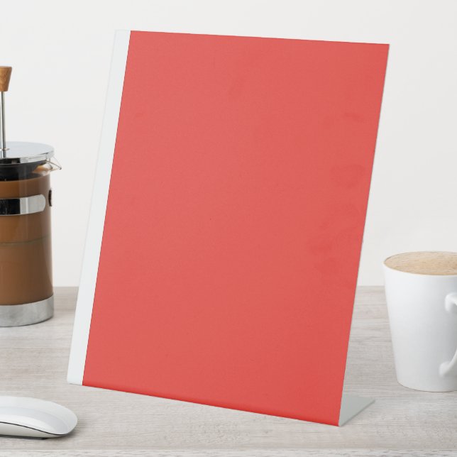 a red background with a white border pedestal sign (In SItu)