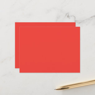 a red background with a white border postcard