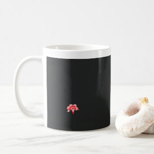 a red flower on a black background coffee mug