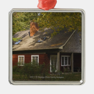 A Red Log Home Metal Tree Decoration