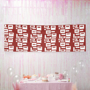 A red rug with a textured pattern is spread out on banner