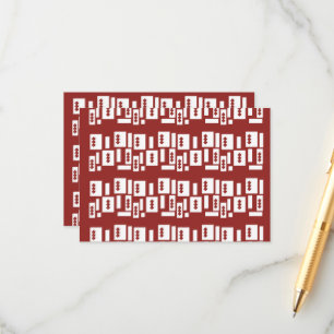 A red rug with a textured pattern is spread out on enclosure card