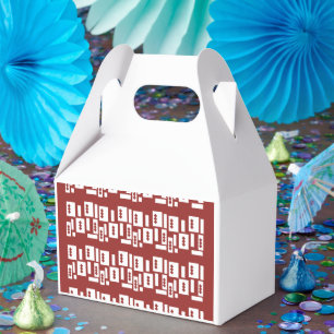 A red rug with a textured pattern is spread out on favour box