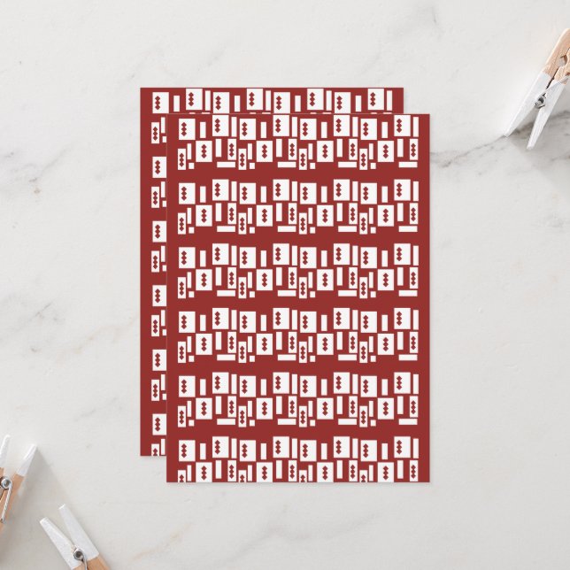 A red rug with a textured pattern is spread out on invitation (Front/Back In Situ)