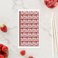 A red rug with a textured pattern is spread out on