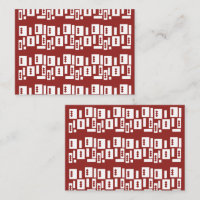 A red rug with a textured pattern is spread out on
