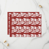 A red rug with a textured pattern is spread out on