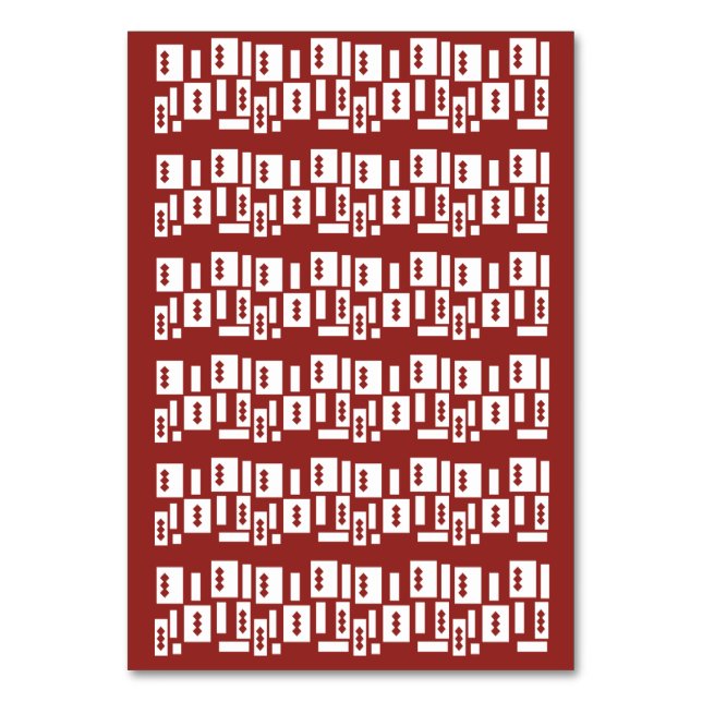 A red rug with a textured pattern is spread out on table number (Front)