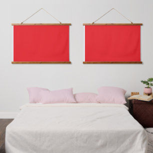A red square enclosed by a thin white border, crea hanging tapestry