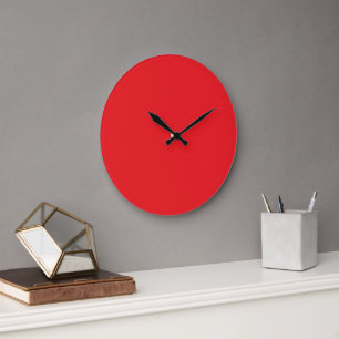 A red square enclosed by a thin white border, crea large clock