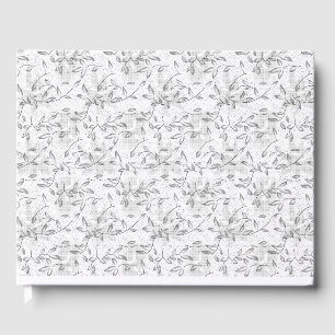 A refined black and white floral motif, highlighti guest book