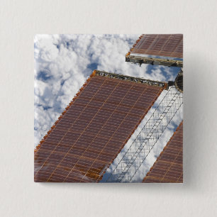 A repaired solar array 15 cm square badge