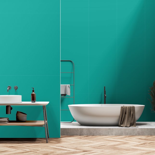 A rich teal green area highlighted by a contrastin wallpaper (Bathroom)