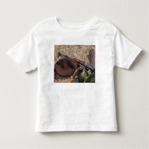 A rifle, military cover and canteen toddler T-Shirt