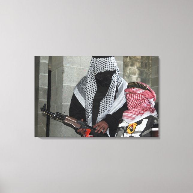A role-playing enemy aggressor arms a dummy canvas print (Front)