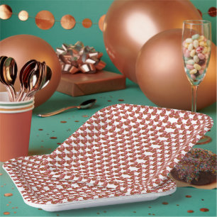 A rolled-up piece of wrapping paper with a festive plate