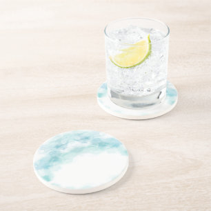 A round ceramic plate featuring a pale blue  coaster
