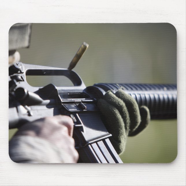 A round flies from the chamber of an M-16A2 Mouse Pad (Front)