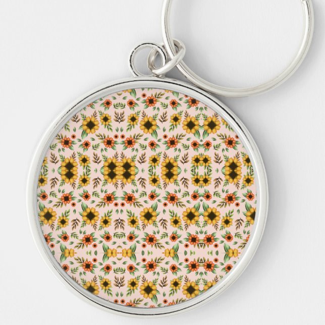 A round keychain with a floral mosaic design (Front)