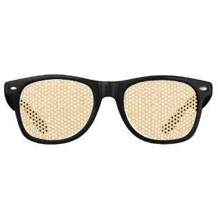 A round rug with a vibrant blend of yellow and ora retro sunglasses