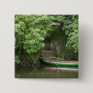 A Row Boat Roped At Some Stairs Along The Shore 15 Cm Square Badge