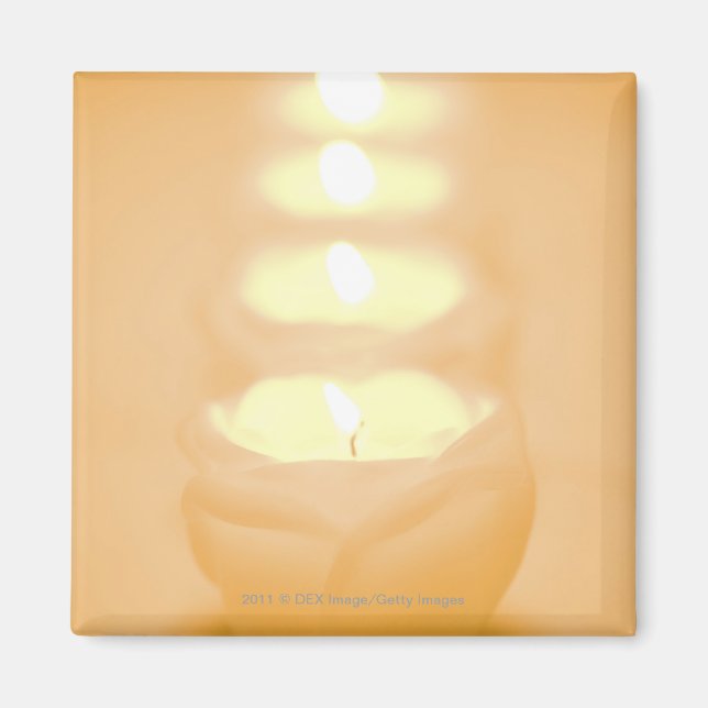 A row of lit candles magnet (Front)