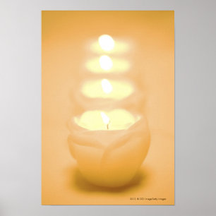 A row of lit candles poster