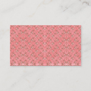 A rug with a red and pink motif features a decorat business card