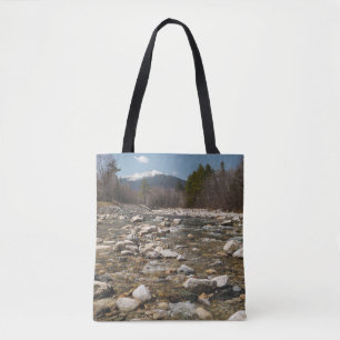 A running stream river with clear water flowing wi tote bag