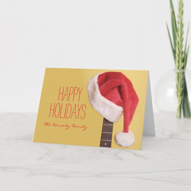 A Santa hat hangs on an acoustic guitar in front Holiday Card (Front)