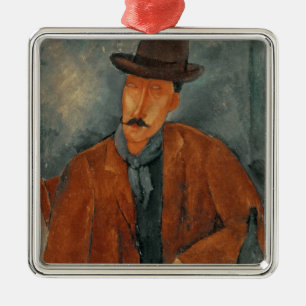 A seated man leaning on a table metal tree decoration