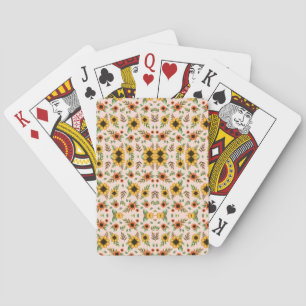 A set of playing cards with ornate, floral-pattern