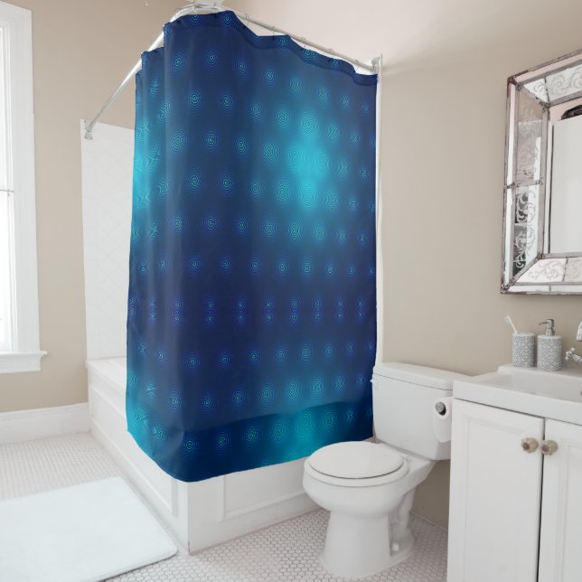 A shower curtain with a gradient blue and teal (In Situ)