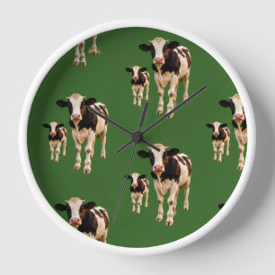 a silly herd of cows on a green background clock