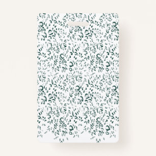 A silver drop splashes into a pool of white liquid ID badge