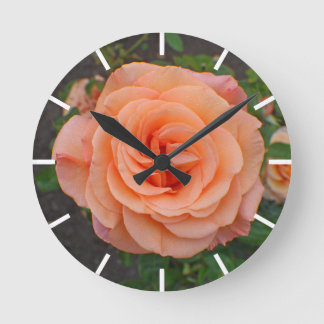 A Single Orange Flower Round Clock