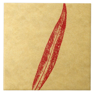 A single willow leaf printed in red on tan paper tile