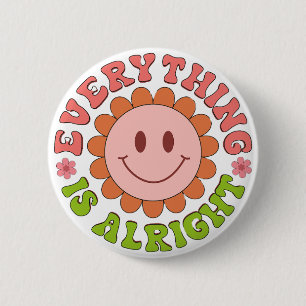 A smiling face with a flower and the words everyth 6 cm round badge