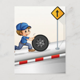 A smiling mechanic pushing the tire postcard