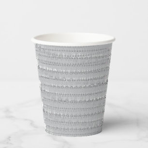 A snow-covered mountain range under a clear blue s paper cups