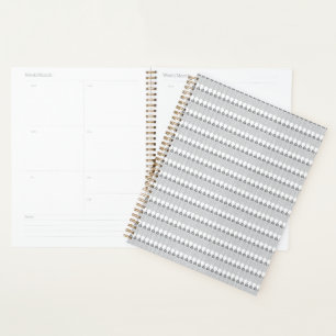A snow-covered mountain range under a clear blue s planner
