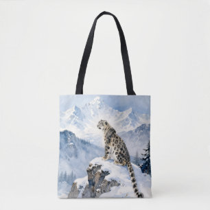 A Snow Leopard on Snowy Peak Tote Bag