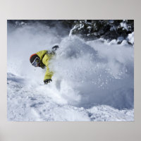 A snowboarder rips untracked powder turns in 2